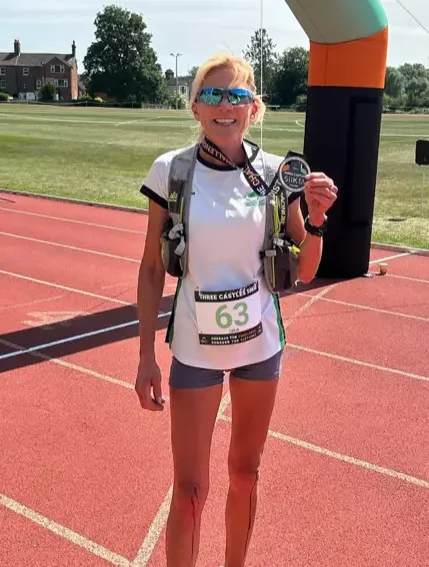 Sharon Barnett secures a podium finish at the Three Castles 50K ultra trail race with 2nd in age group and 5th lady overall. A true Harrier effort!