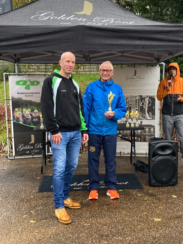 Maidstone Half Marathon medalists getting their trophies in the 2024 event. Hosted by the Maidstone Harriers Run and Tri Club