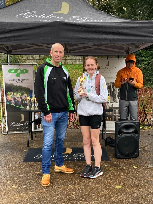 Maidstone Half Marathon medalists getting their trophies in the 2024 event. Hosted by the Maidstone Harriers Run and Tri Club