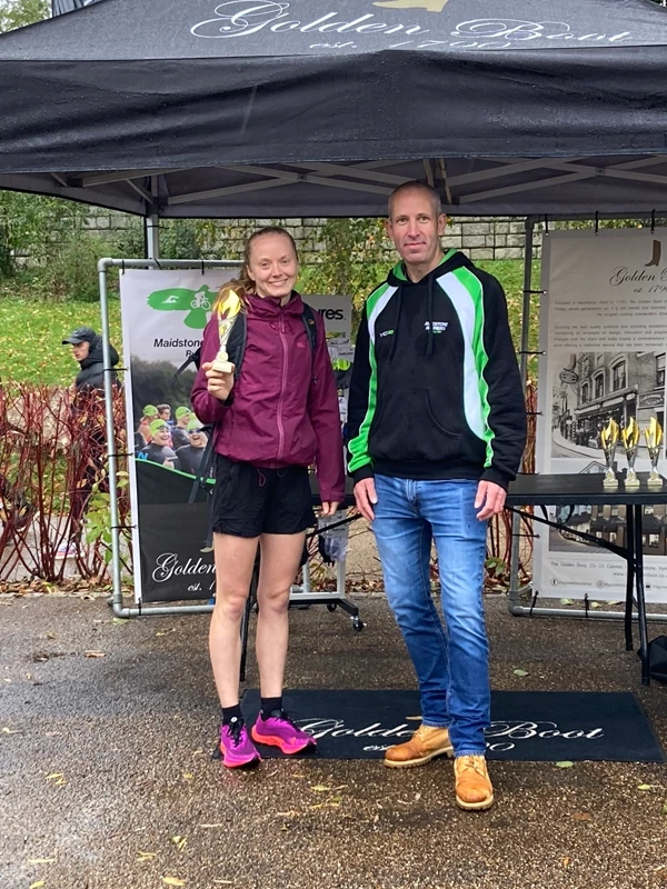 Maidstone Half Marathon medalists getting their trophies in the 2024 event. Hosted by the Maidstone Harriers Run and Tri Club