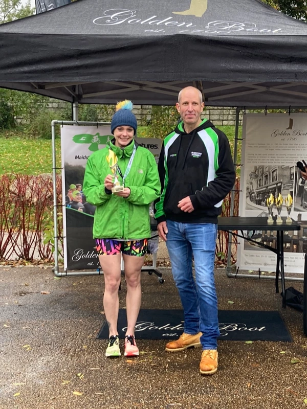Maidstone Half Marathon medalists getting their trophies in the 2024 event. Hosted by the Maidstone Harriers Run and Tri Club