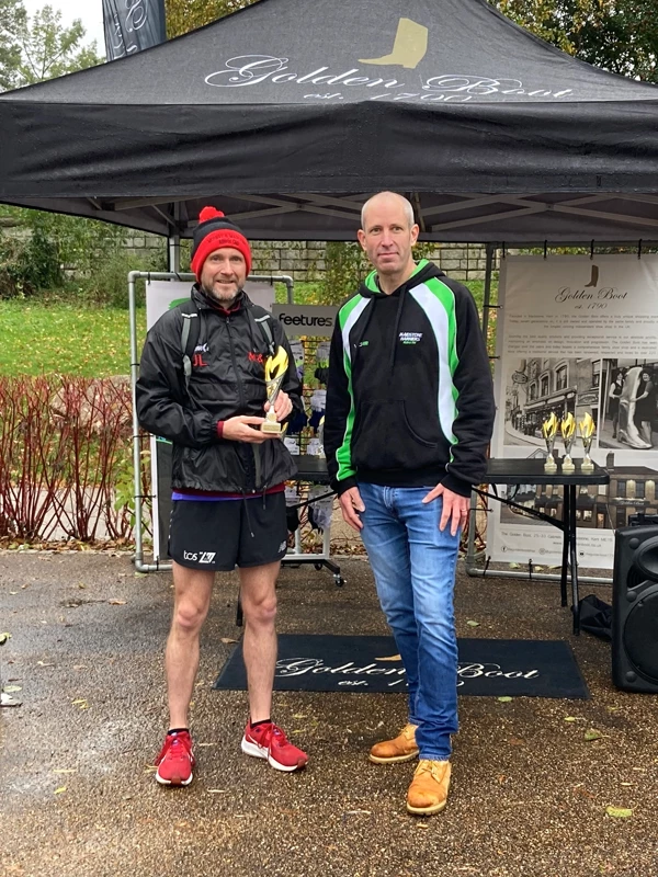 Maidstone Half Marathon medalists getting their trophies in the 2024 event. Hosted by the Maidstone Harriers Run and Tri Club