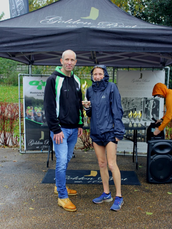Maidstone Half Marathon medalists getting their trophies in the 2024 event. Hosted by the Maidstone Harriers Run and Tri Club