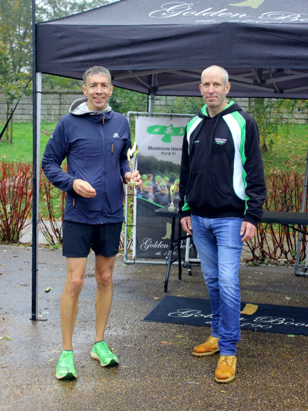 Maidstone Half Marathon medalists getting their trophies in the 2024 event. Hosted by the Maidstone Harriers Run and Tri Club