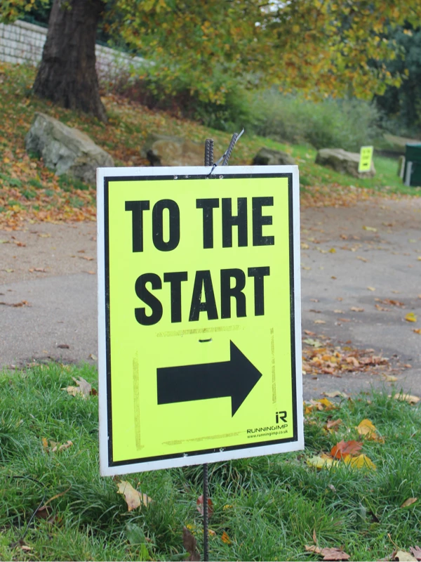 Signpost for Maidstone Half Marathon 2025 at Mote Park. Hosted by Maidstone Harriers, the community driven running club