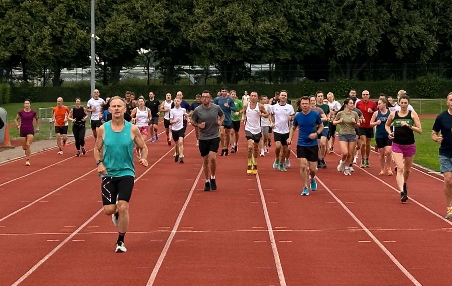 Maidstone Harriers track session with runners on the track running towards the camera