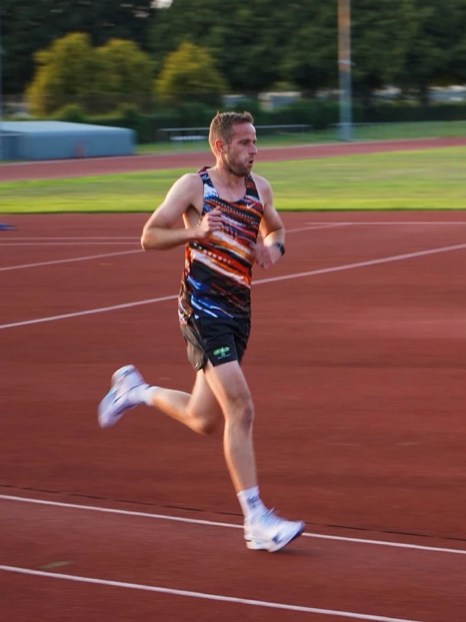 Phil Edmonds mid-rep at the track, focused on form.