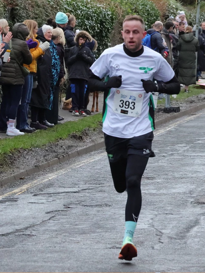 Phil Edmonds running a local race in a Maidstone Harriers T-shirt.