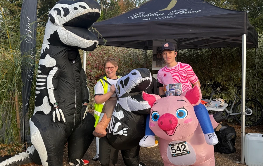 Support dinosaur and pig costumes for the Maidstone Half Marathon 2025 at Mote Park. Hosted by Maidstone Harriers, the community driven running club