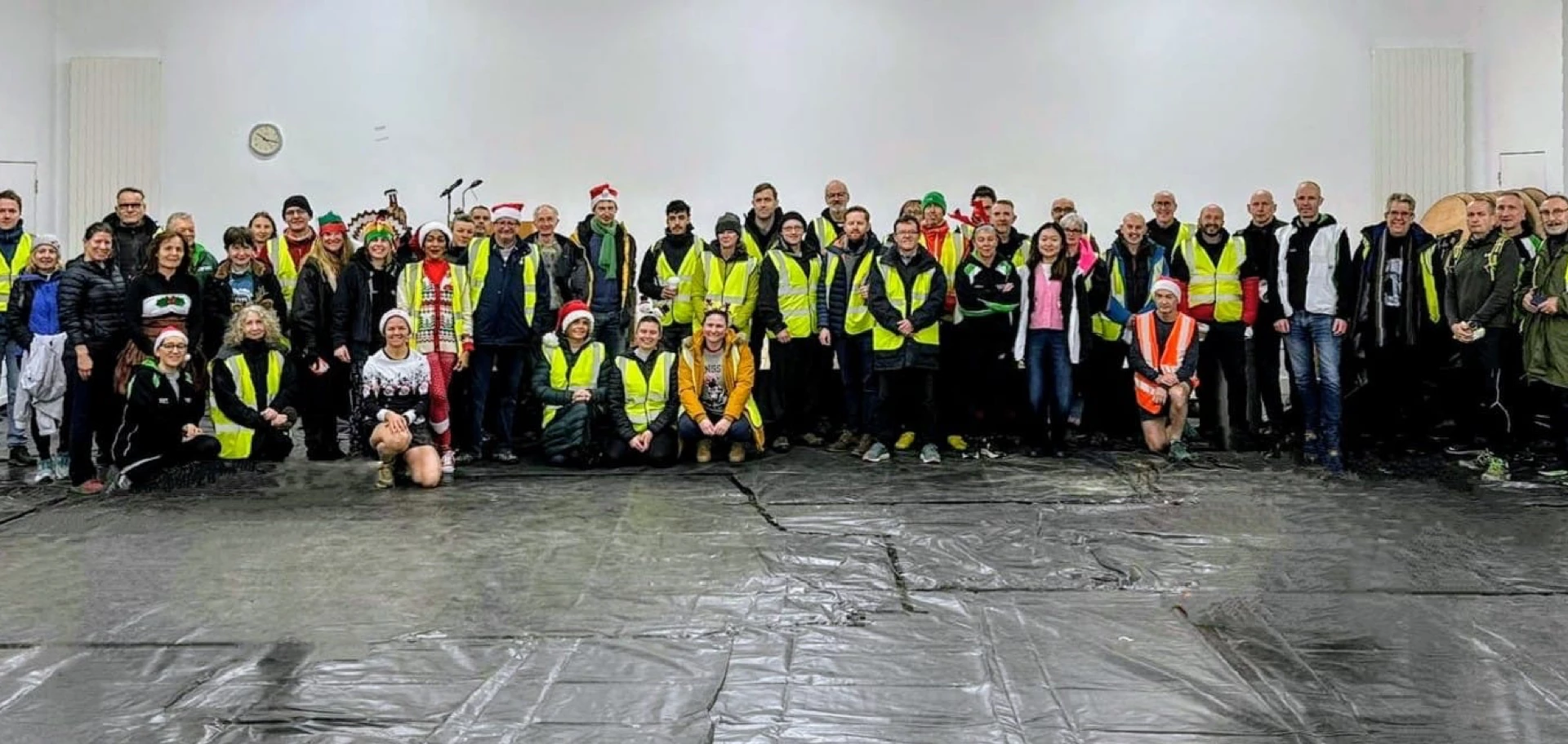 Volunteers lined up for the Turkey Run 2024 at East Malling Research Centre. Hosted by Maidstone Harriers, the community driven running club