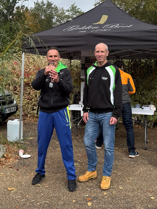 Maidstone Half Marathon medalist, Keith Dean, getting their trophy in the 2025 event. Hosted by the Maidstone Harriers Run and Tri Club
