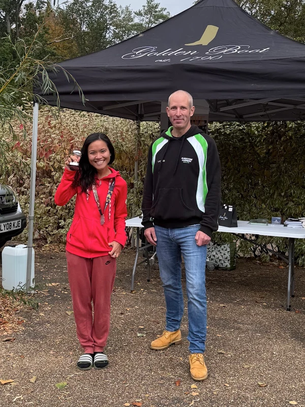 Maidstone Half Marathon medalist getting their trophy in the 2025 event. Hosted by the Maidstone Harriers Run and Tri Club