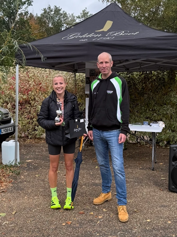 Maidstone Half Marathon medalist, Beth Rose, getting their trophy in the 2025 event. Hosted by the Maidstone Harriers Run and Tri Club
