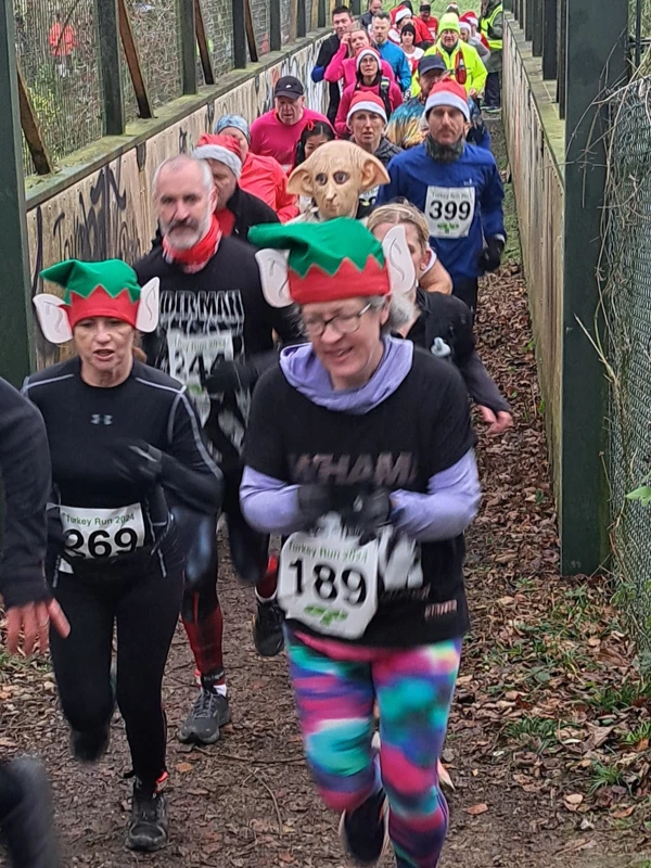 Group of runners in fancy dress taking part in the Turkey Run, 2024, organised by the Maidstone Harriers