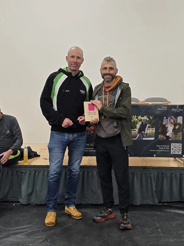 Turkey Run medalist getting their trophy in the 2024 event. Hosted by the Maidstone Harriers Run and Tri Club