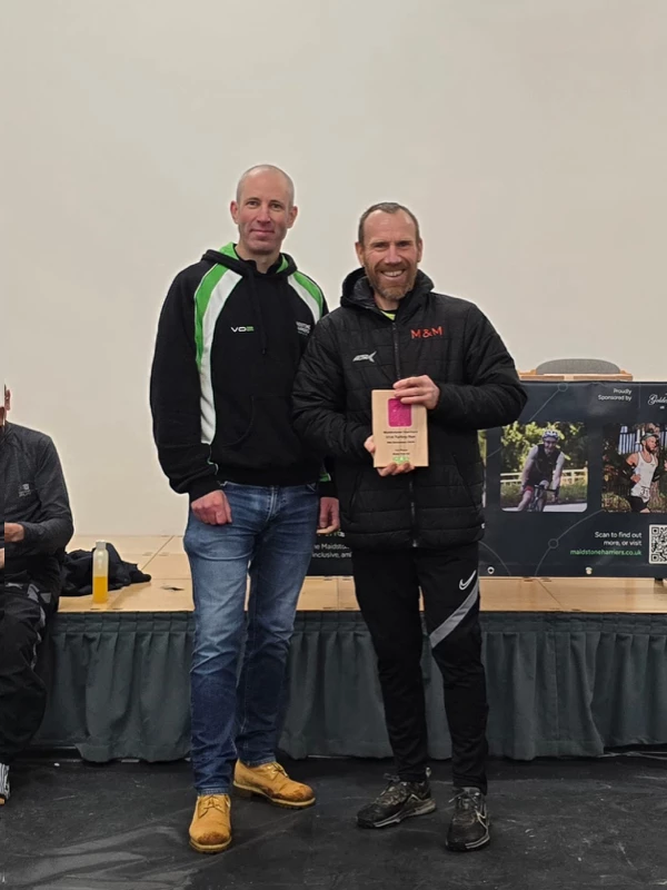 Turkey Run medalist getting their trophy in the 2024 event. Hosted by the Maidstone Harriers Run and Tri Club