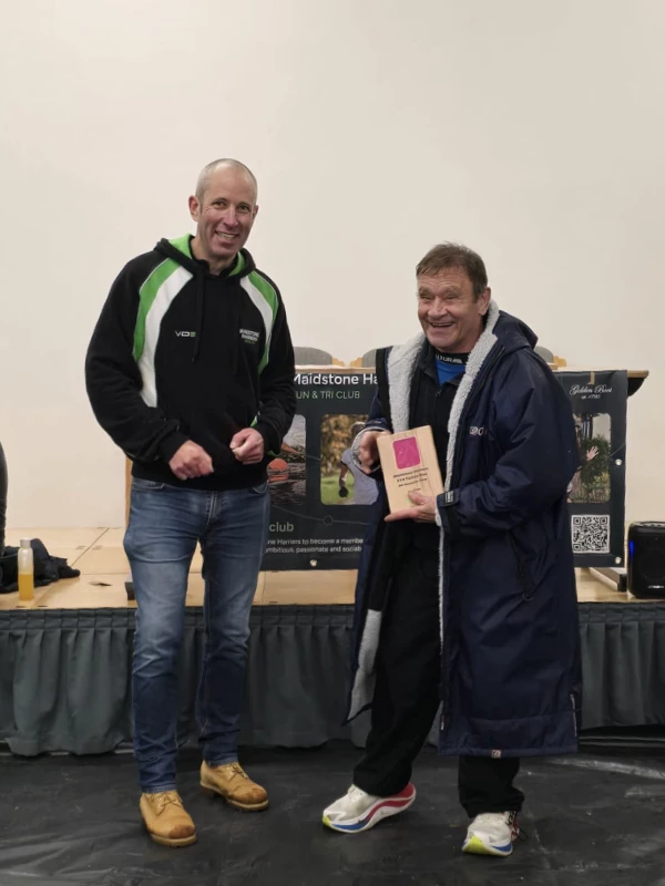 Turkey Run medalist getting their trophy in the 2024 event. Hosted by the Maidstone Harriers Run and Tri Club