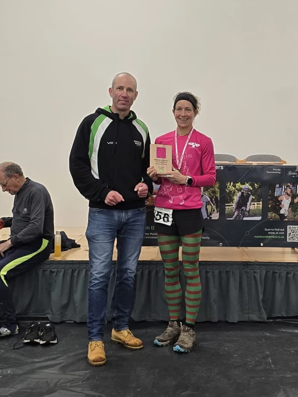 Turkey Run medalist getting their trophy in the 2024 event. Hosted by the Maidstone Harriers Run and Tri Club