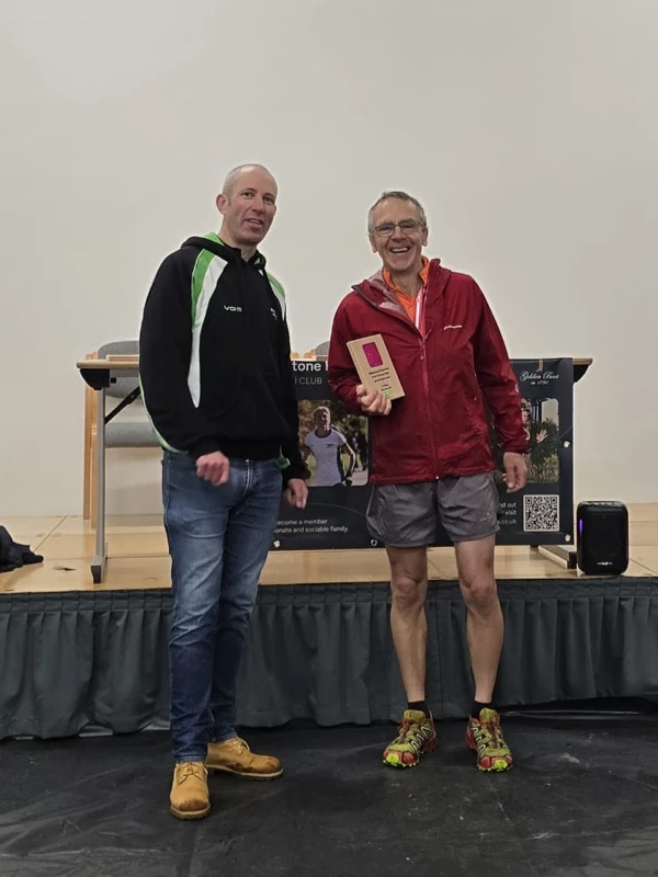 Turkey Run medalist getting their trophy in the 2024 event. Hosted by the Maidstone Harriers Run and Tri Club