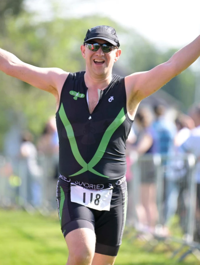 Tim Hilder in his Maidstone Harriers trisuit competing during the run leg of the Eastbourne Triathlon