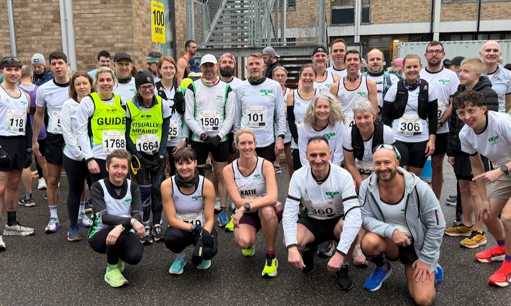 Maidstone Harriers club group photo at Canterbury 10 Mile, with runners and supporters before the race.