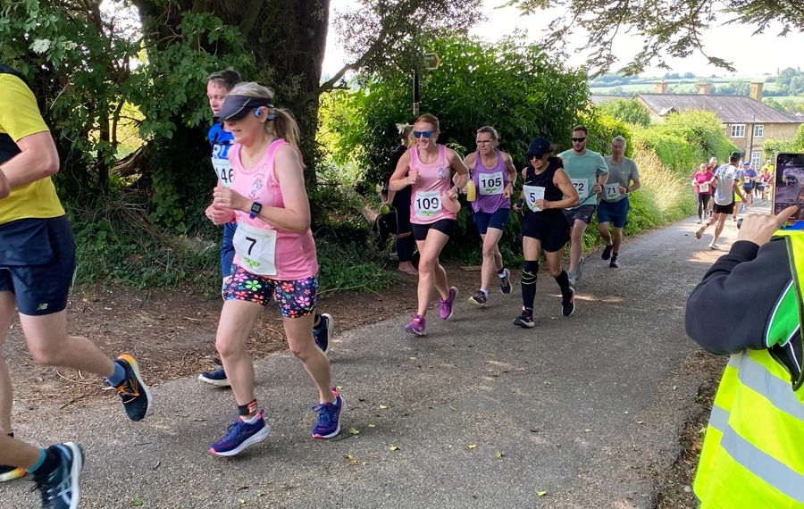 Runners tackling the uphill section at the 2025 Maidstone Harriers David Thornby 10k near East Farleigh