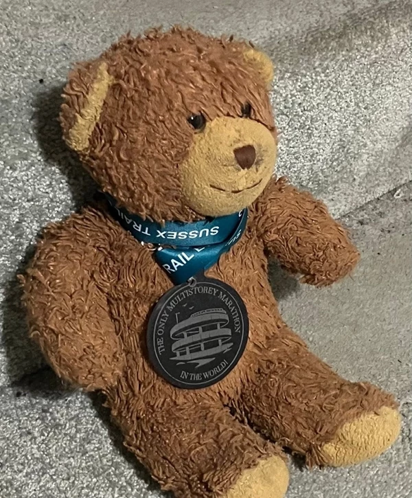 Teddy bear wearing a finisher medal from the Southend multi-storey car park marathon