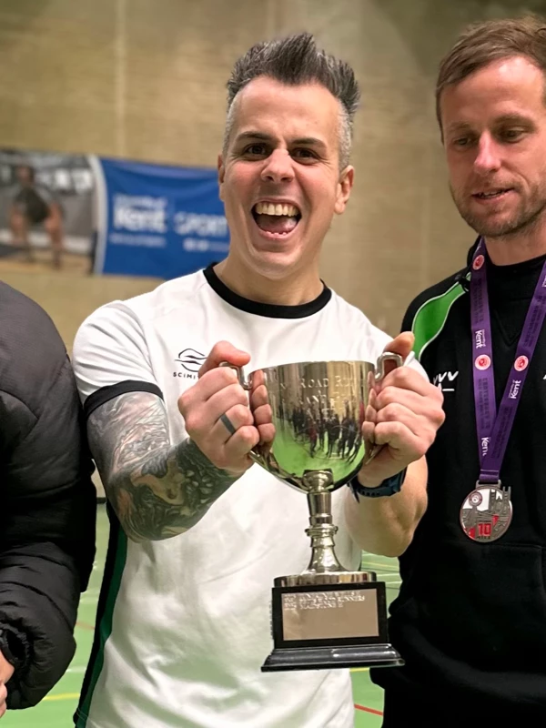 Simon Apps holding the Kent Champs trophy and smiling after the Canterbury 10 Mile 2026 event