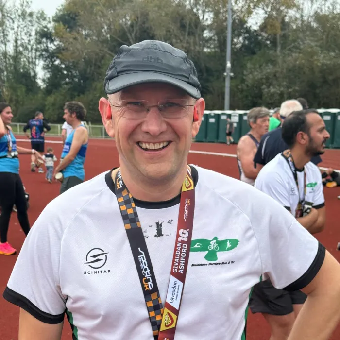 Tim Hilder of Maidstone Harriers smiling after completing the Givaudan Ashford 10K