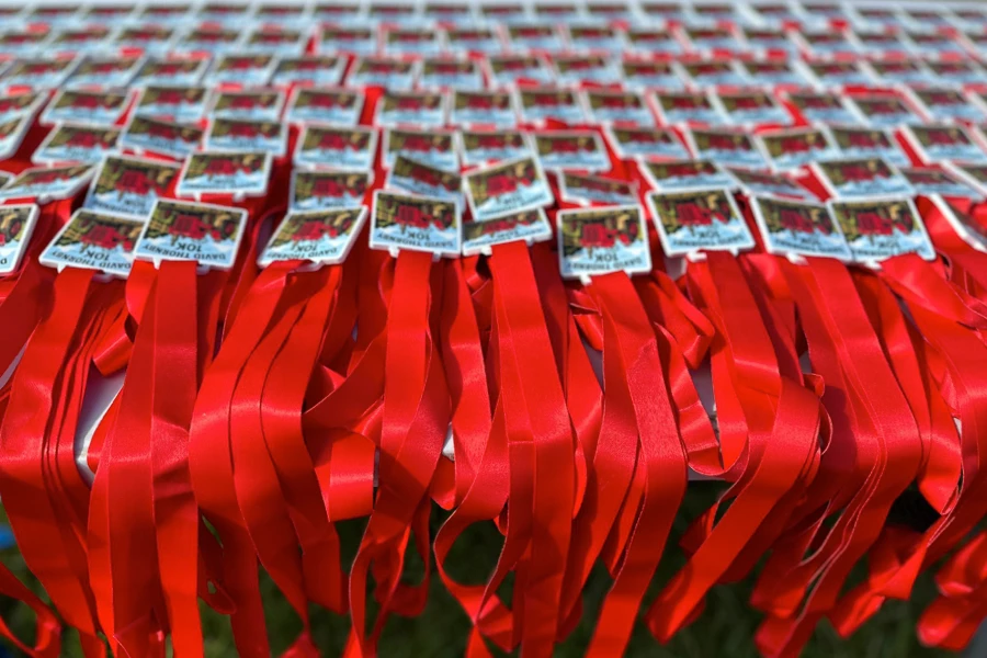 Rows of finisher medals prepared for runners at the 2026 Maidstone Harriers David Thornby 10k.