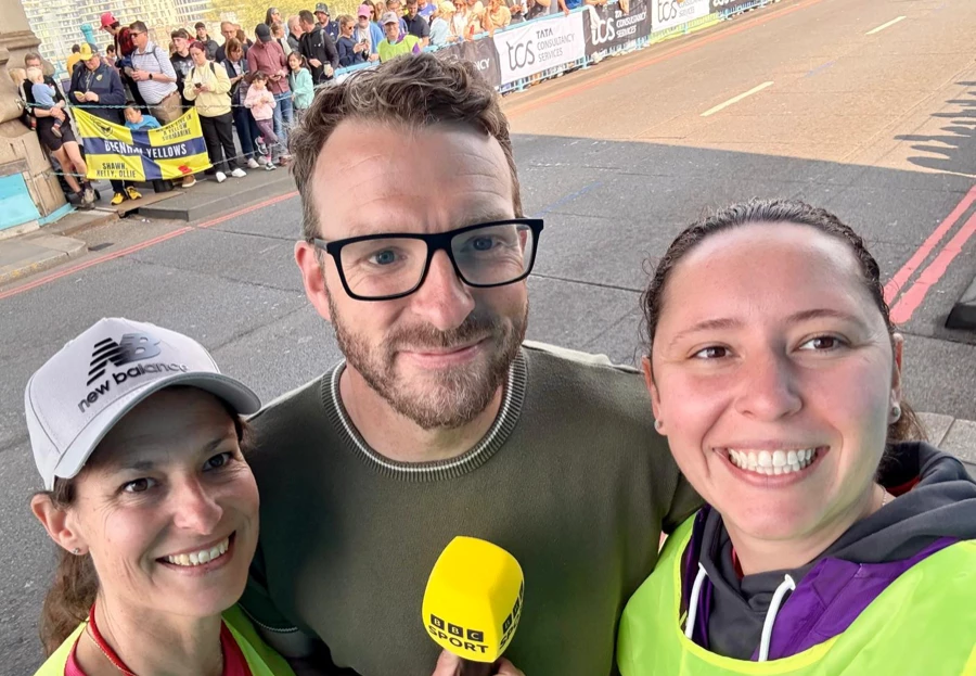 Debbie Addison with BBC Sport and another runner on race day at the London Marathon.