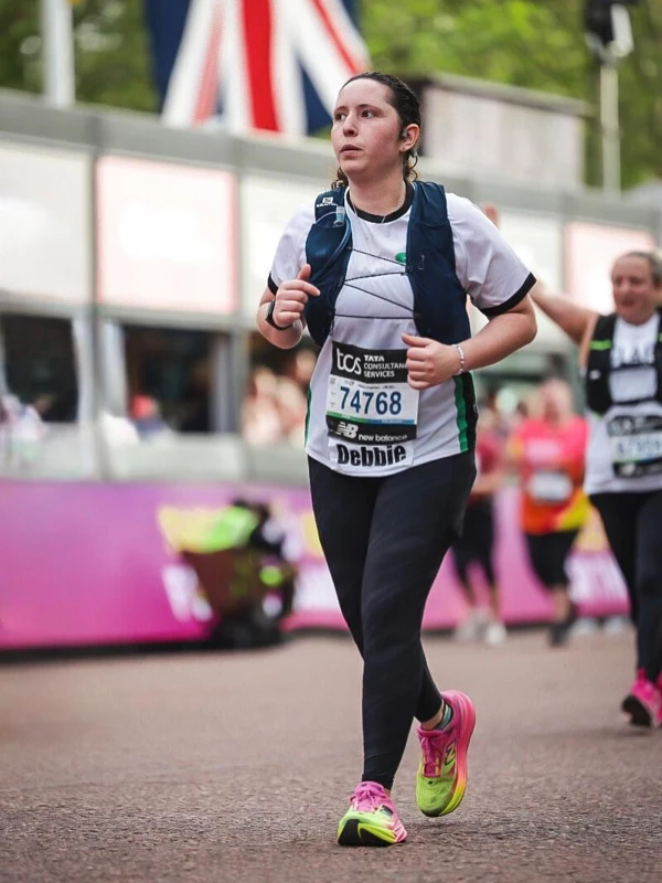 Debbie Addison running in Maidstone Harriers kit at the 2026 London Marathon.