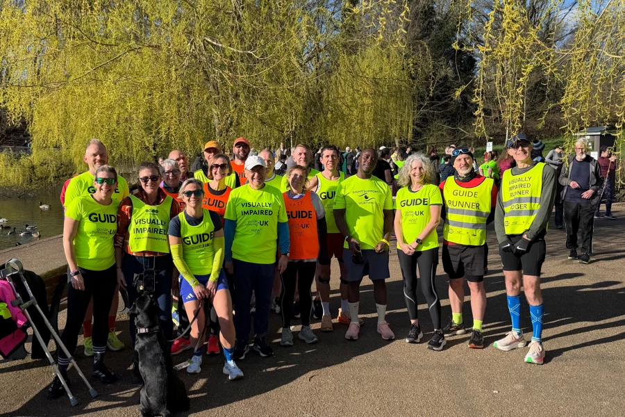 Maidstone Harriers runner Roger Hyland with visually impaired runners and guide runners at Mote Park parkrun