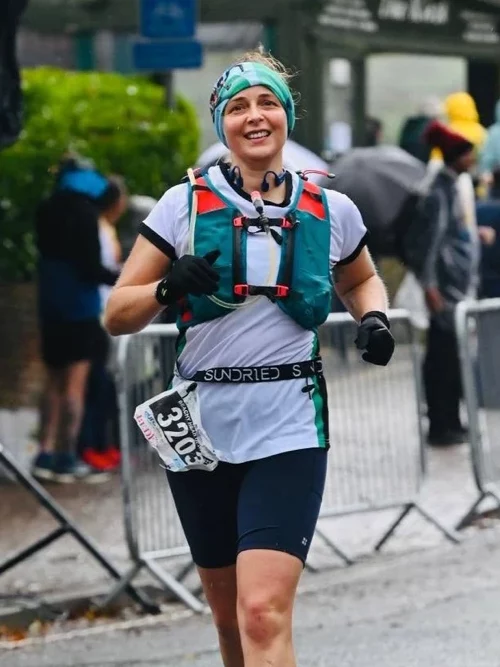 Maidstone Harriers runner Jo Smit running in wet conditions during an ultramarathon event